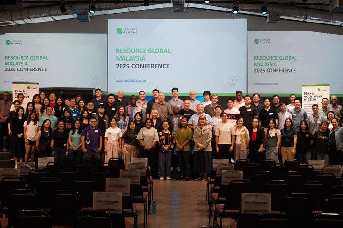 Event photographer capturing a large group photo at a conference