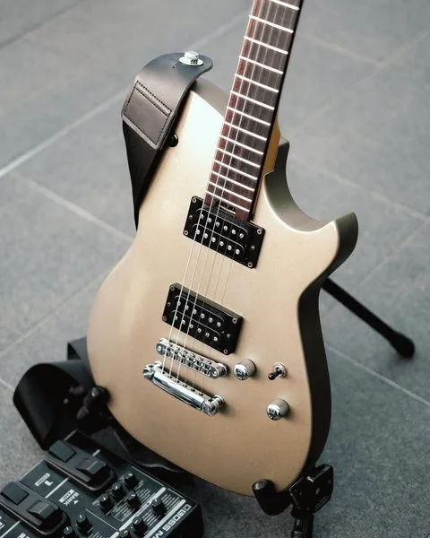 Event photography in Penang: gold electric guitar at a product launch